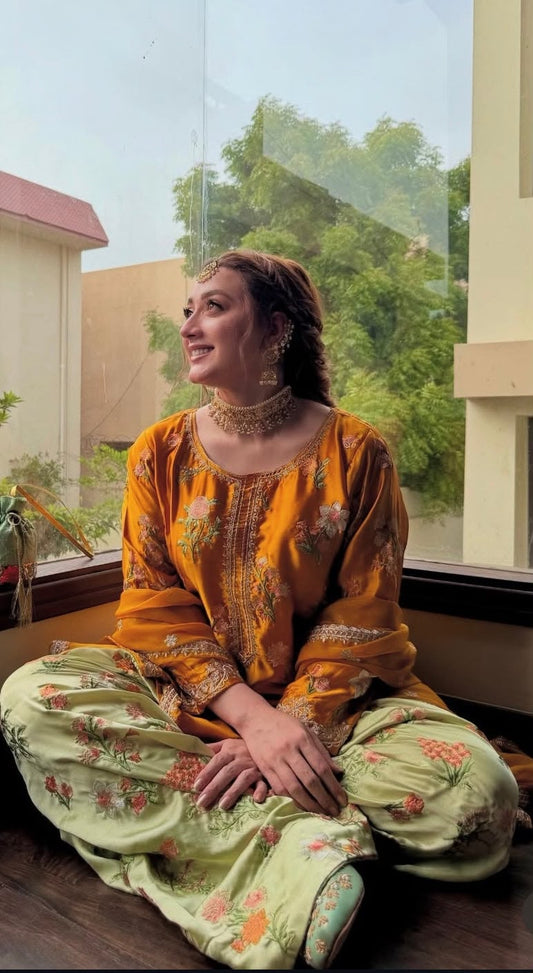 3-piece embroidered suit in mustard yellow. With beautiful floral embroidery on shirt and trouser paired with a fancy 4-side embroidered chiffon dupatta