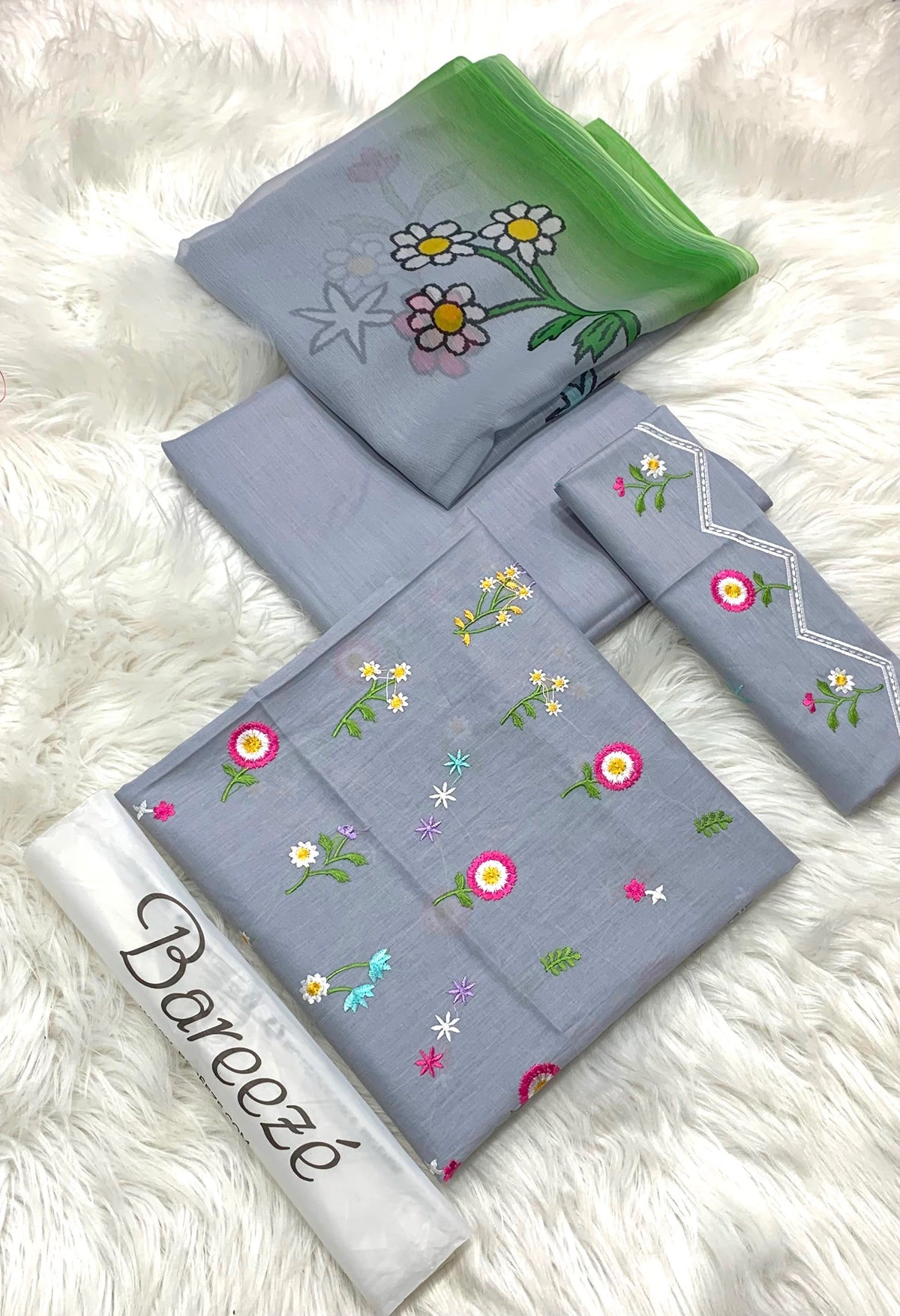 3-piece embroidered lawn suit in powder blue. With cute floral embroidery,