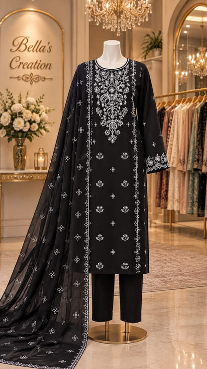 Bareeze Winter – Model wearing black embroidered Dhanak suit with digital printed shawl