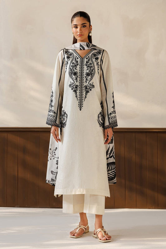 Baroque Winter 2026 - Model wearing ivory embroidered dhanak 3-piece suit with black botanical digital print shawl