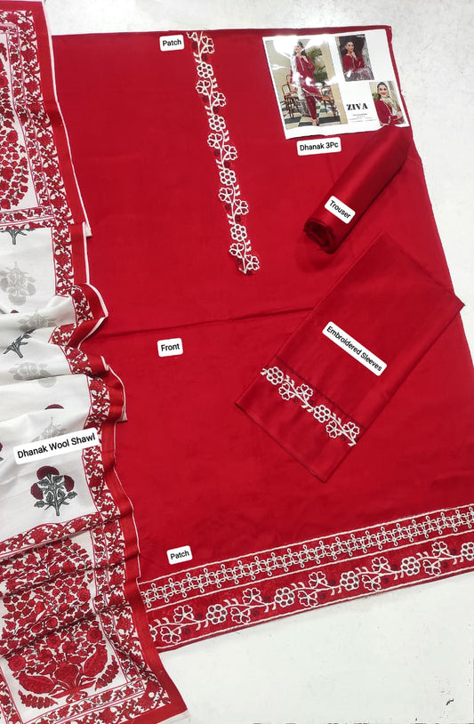 Woman wearing a red Zava embroidered Dhanak suit with a white and red printed shawl