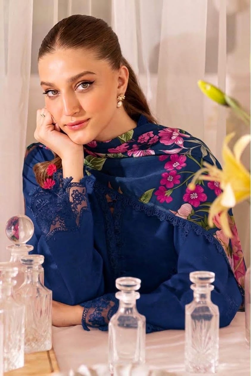 Woman wearing a navy Farisha embroidered Dhanak suit with a pink floral printed shawl