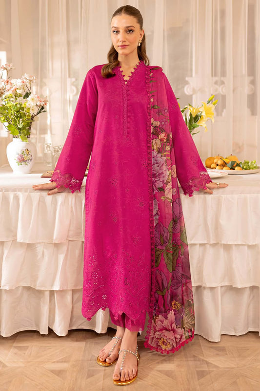 Woman wearing a hot pink Farisha embroidered Dhanak suit with a coordinating floral shawl
