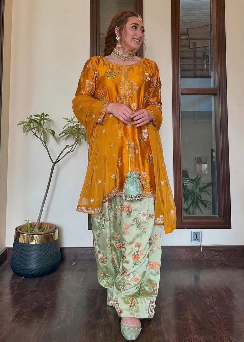 3-piece embroidered suit in mustard yellow. With beautiful floral embroidery on shirt and trouser paired with a fancy 4-side embroidered chiffon dupatta